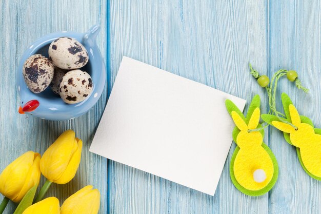 Easter card with eggs and yellow tulips