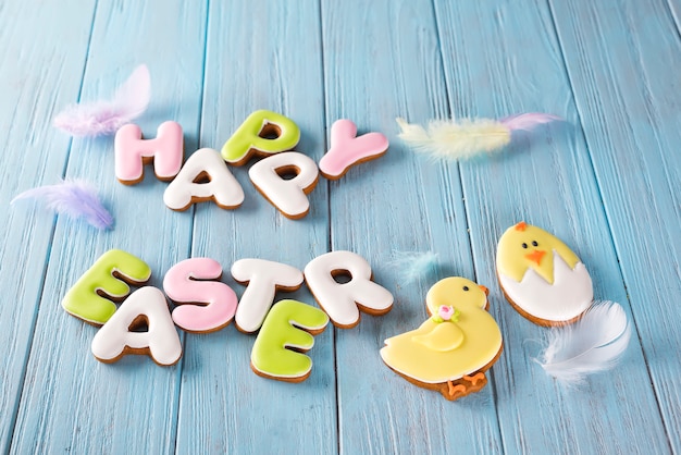 Easter chicken cookies end cookies letter Happy Easter on wood background