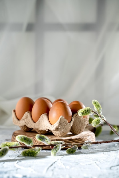 easter chicken eggs on the table and willow a symbol of the holiday cultural traditions