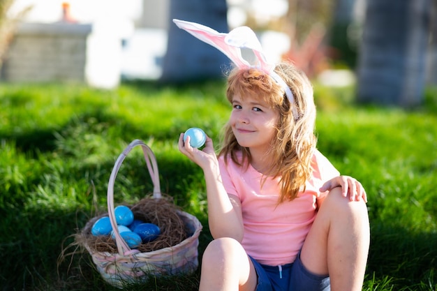 Easter children Easter bunny child boy with cute face Kids hunting easter eggs