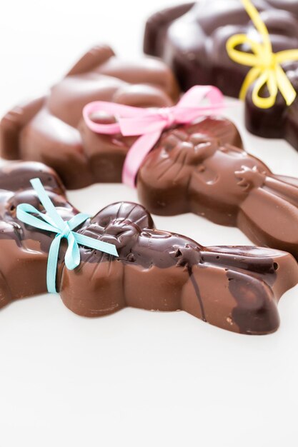 Photo easter chocolate bunnies made from solid milk and dark chocolate.