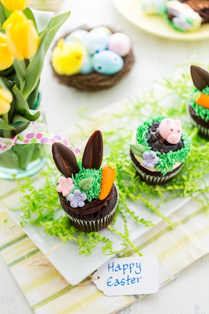 Easter chocolate cupcakes decorated with piggy and bunny ears