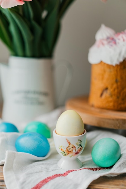 Easter colored eggs. Easter traditions and symbols. Pink Easter eggs in egg stand