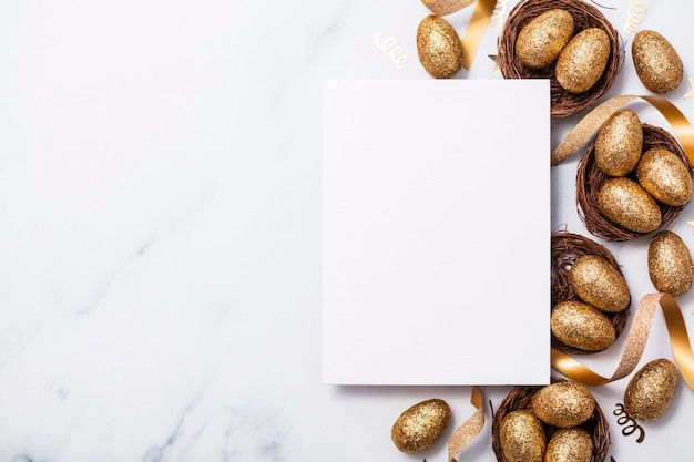 Easter composition Blank card with gold eggs and nests