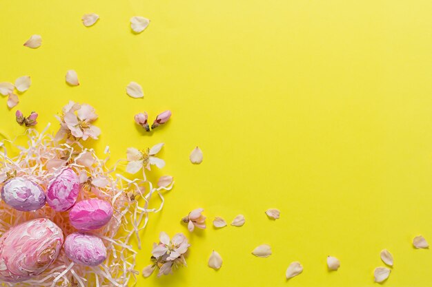 Easter composition of colored eggs and almond flowers