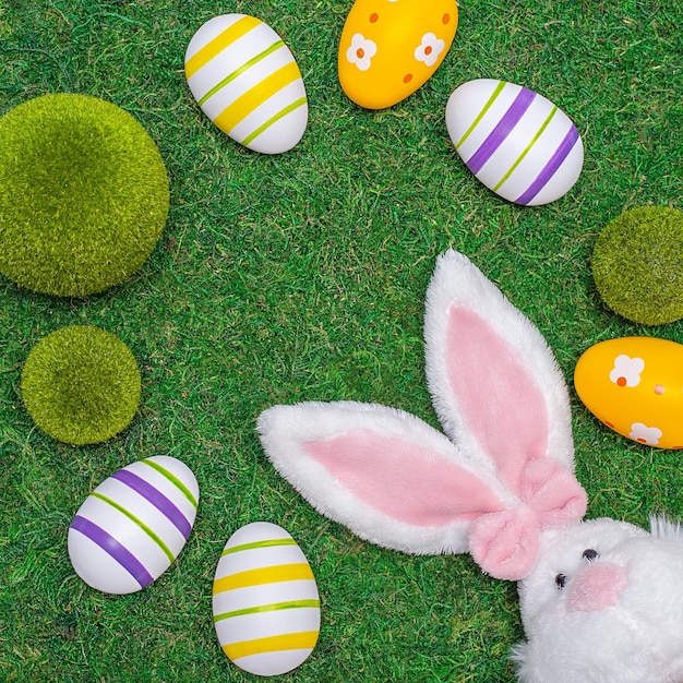 Easter composition on a green natural background eggs and a rabbit