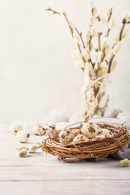 Easter composition of quail eggs in the nest