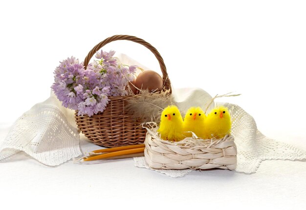 Easter composition on the table Eggs wildflowers candles and toys closeup