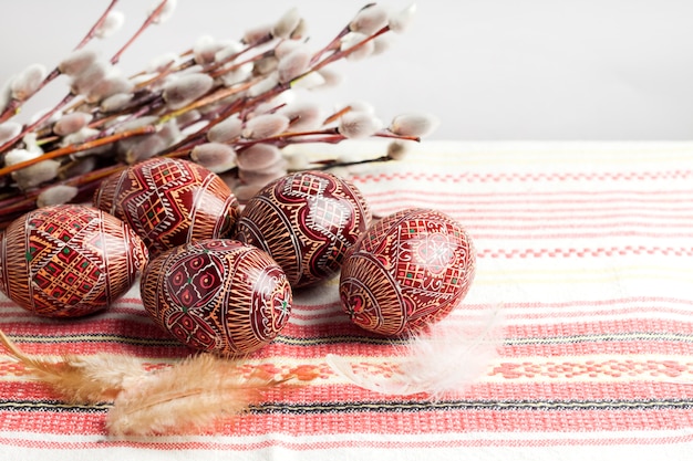 Easter composition on traditional Ukrainian cloth with feathers