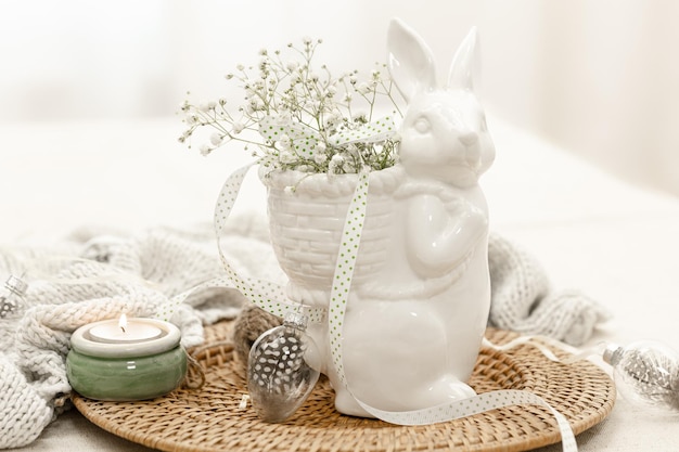 Easter composition with a ceramic hare and gypsophila flowers