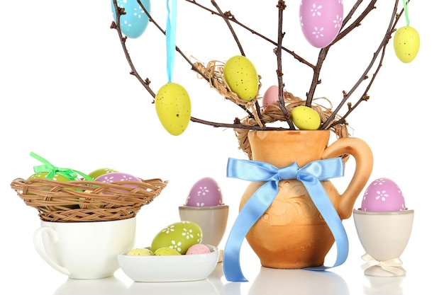 Easter composition with eggs on branches isolated on white