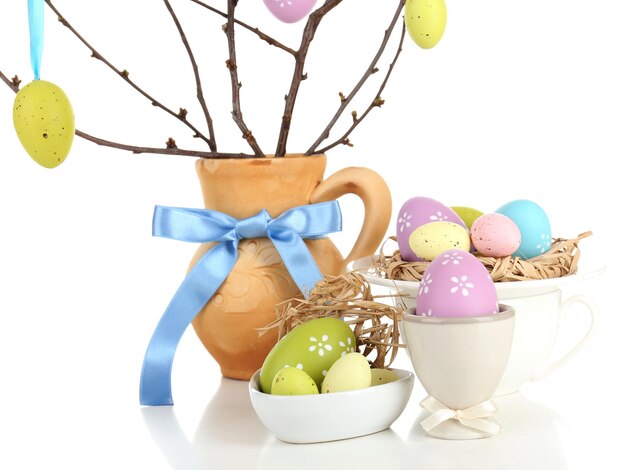 Easter composition with eggs on branches isolated on white