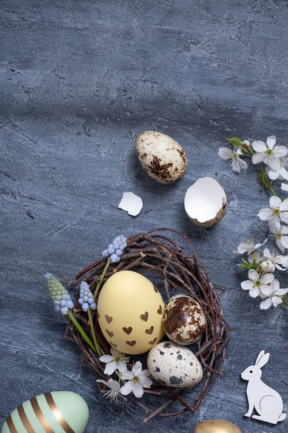 Easter composition with nest white rabbit and eggs flat lay top view