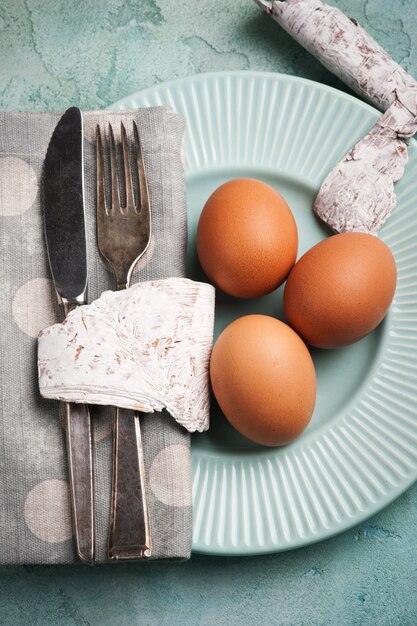 Easter composition with plate, eggs