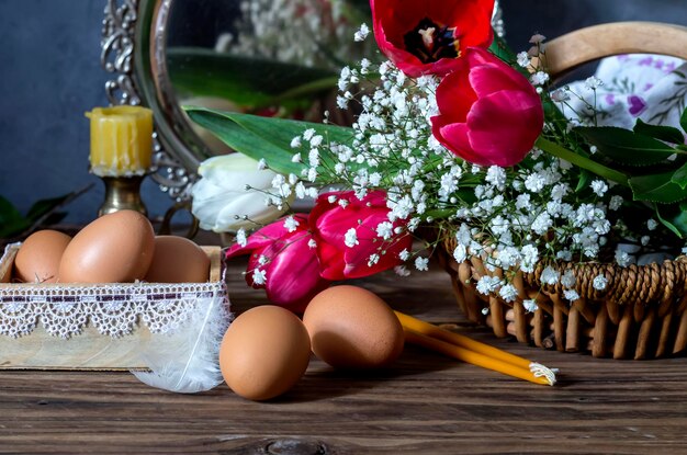 The easter composition with tulips and easter eggs