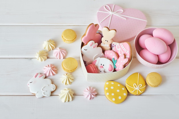 Easter cookies in box with macarons and flowers