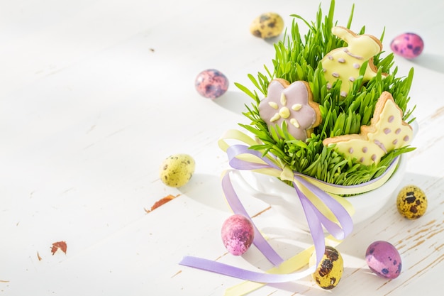Easter cookies and eggs with grass