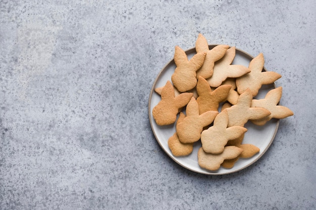 Easter cookies on grey stone background Top view with copy space