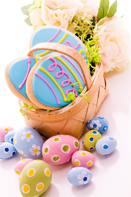 Easter cookies in shape of egg decorated with blue icing.