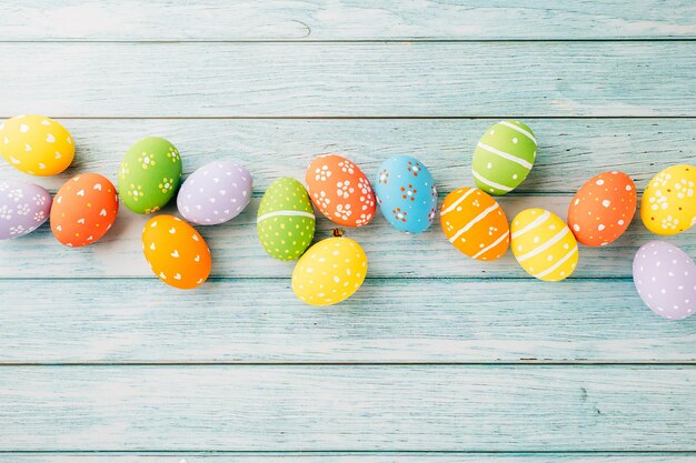 Easter day concept top view holiday banner background web design white colorful easter eggs painted