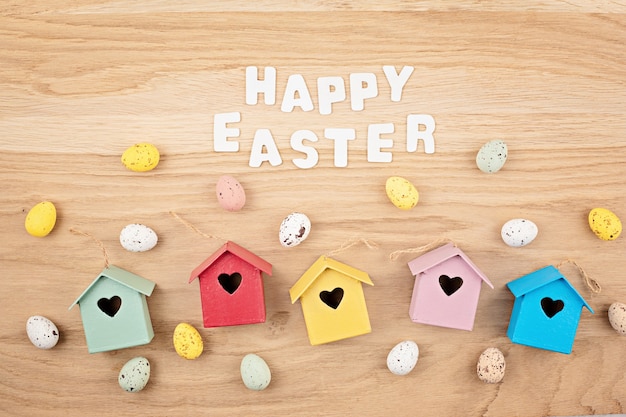 Easter decoration over natural wooden tableTop view, flat lay.