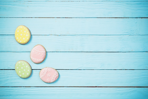 Easter decorations on blue wooden background