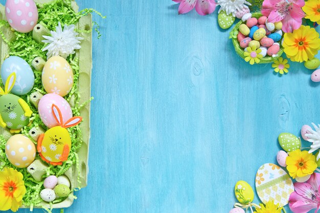 Easter decorations with colorful eggs, candies and flowers