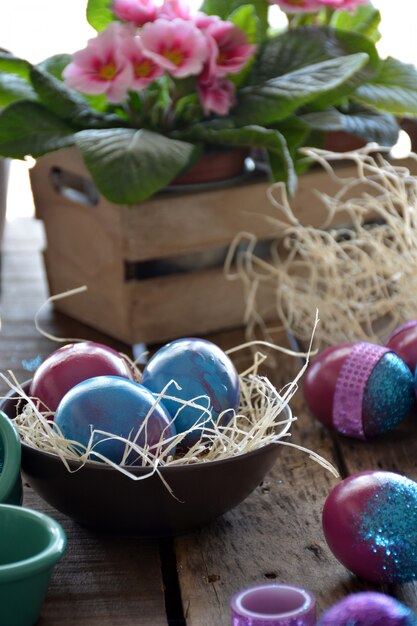 Easter egg painted with bright colors and glitter