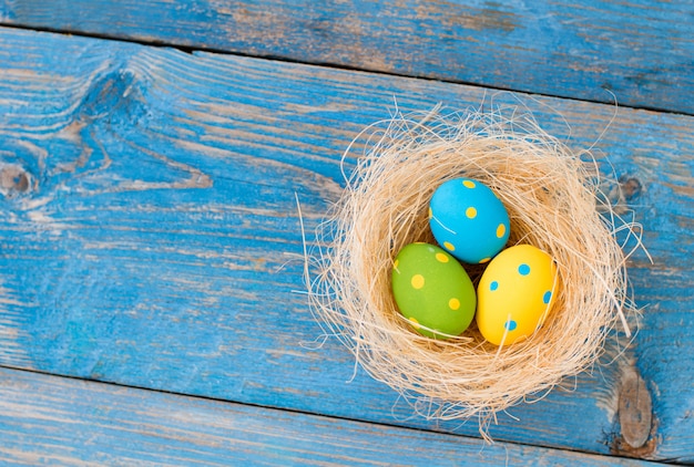 Easter eggs on a blue wooden background