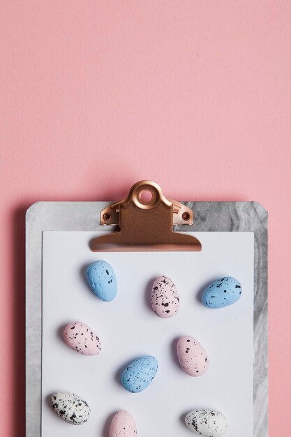 Easter eggs on a clipboard background