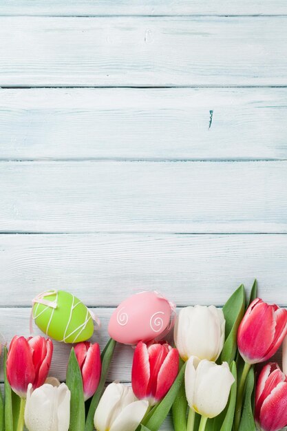 Easter eggs and colorful tulips