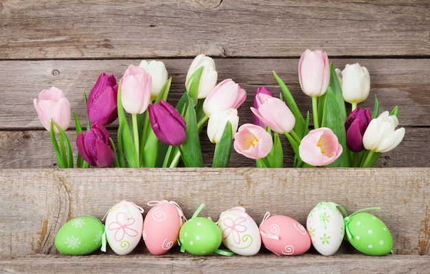 Easter eggs and colorful tulips