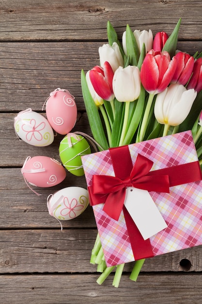 Easter eggs and colorful tulips