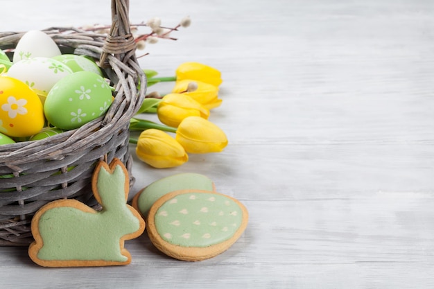 Easter eggs cookies and tulip flowers