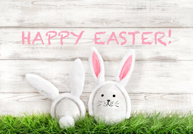 Easter eggs decoration Funny bunnies in green grass Happy Easter