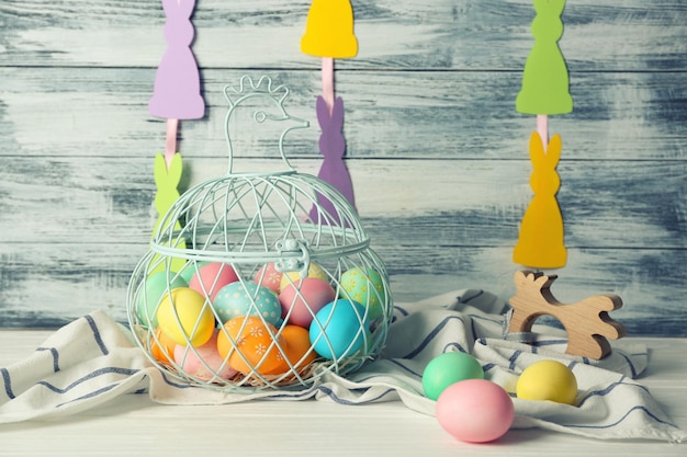 Easter eggs and decorations on table