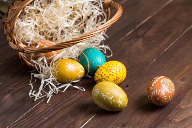 Easter eggs falling out from brown basket