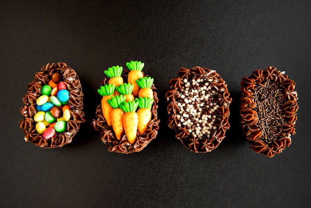 Easter eggs filled with brigadeiro on black background easter concept