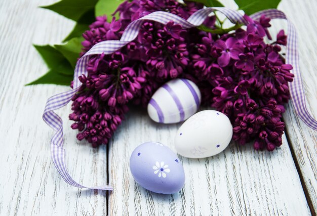 Easter eggs and fresh lilac flowers