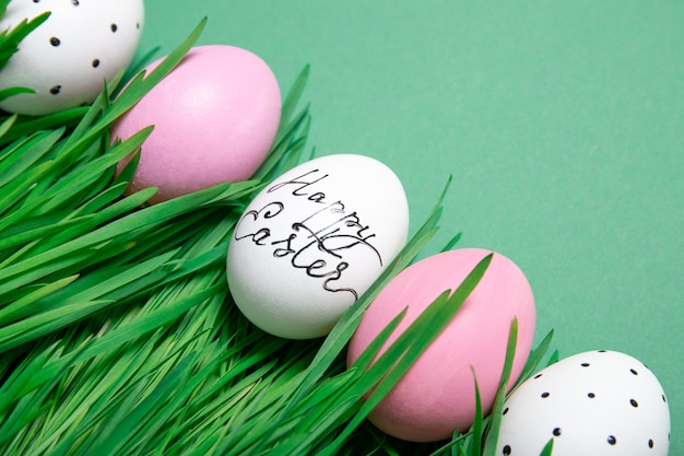 Easter eggs in the grass on a green background