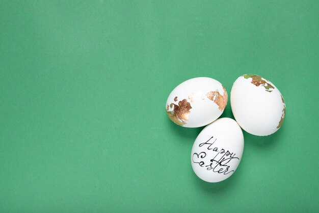 easter eggs on green background