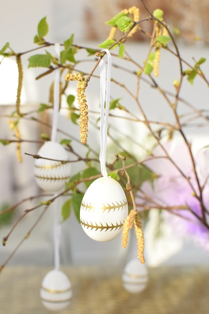 Easter eggs hanging on a branch