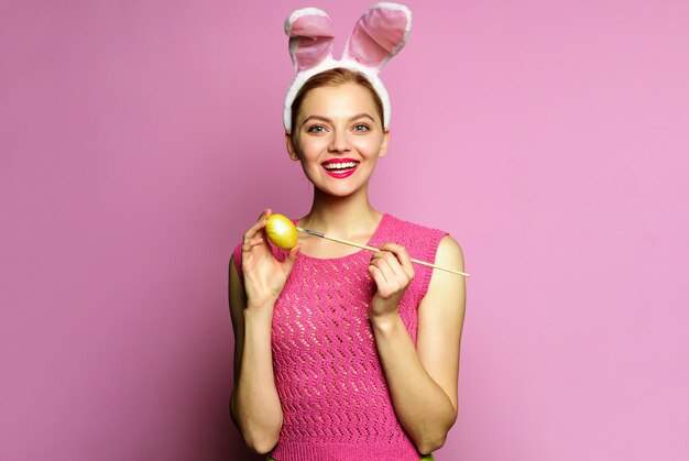 Easter eggs ideas rabbit woman in bunny ears painting egg smiling girl preparing for holidays