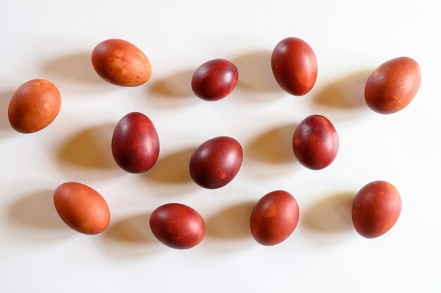 Easter eggs painted onion husks on a white background. coloring the eggs according to the old natural eco-friendly method with peeled onions