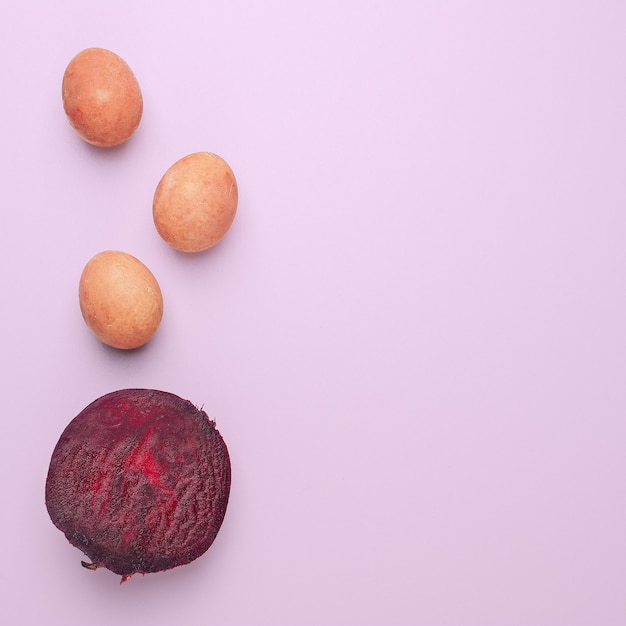 Easter eggs painted with natural dye on a pink background