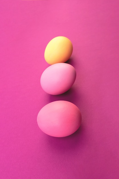 Easter eggs on pink background. Copyspace.