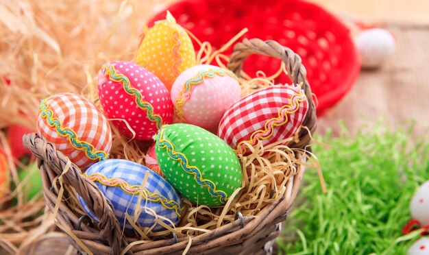 Easter eggs on straw background