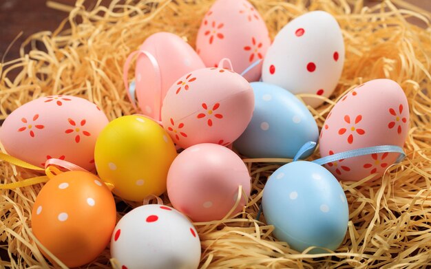 Easter eggs on straw background