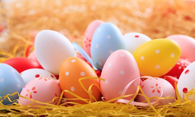 Easter eggs on straw background