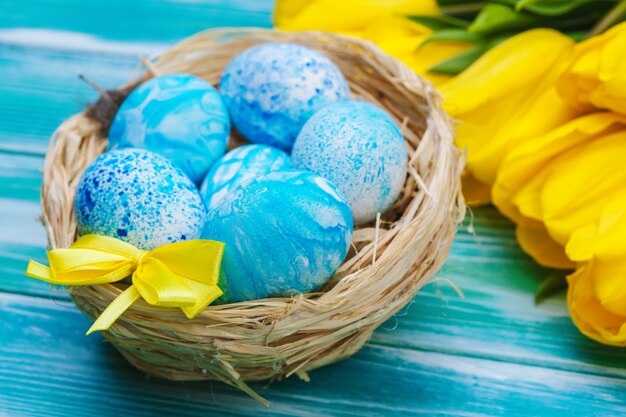 Easter eggs and tulips. Festive decoration 